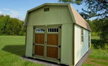 Light green Compass High Barn with brown double doors and olive green trim.